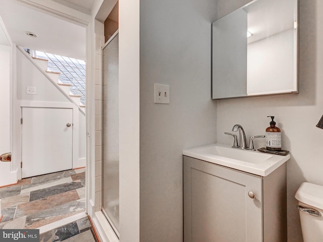 2025 Skyline Rd, Towson, MD 21204 - full bath with toilet, vanity, a shower stall, and stone finish floors