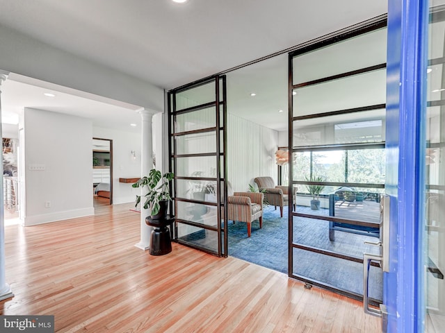 2025 Skyline Rd, Towson, MD 21204 - hallway featuring ornate columns, wood finished floors, and baseboards