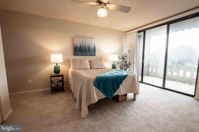 6301 Stevenson Ave Unit 602, Alexandria, VA 22304 - carpeted bedroom with access to outside, a textured ceiling, baseboards, a wall of windows, and ceiling fan