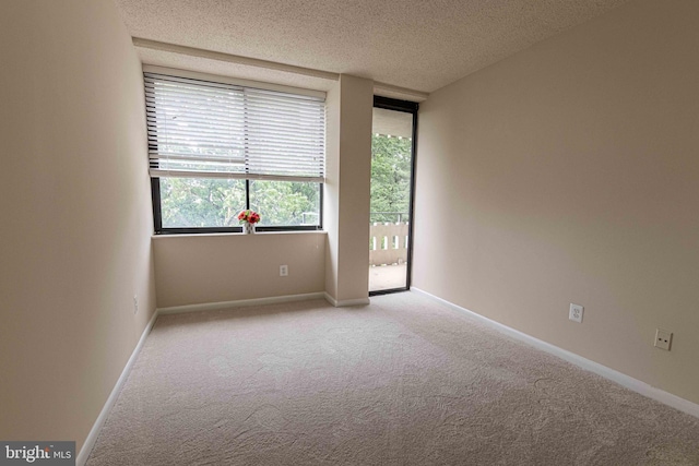 6301 Stevenson Ave Unit 602, Alexandria, VA 22304 - unfurnished room featuring light colored carpet, a textured ceiling, and baseboards