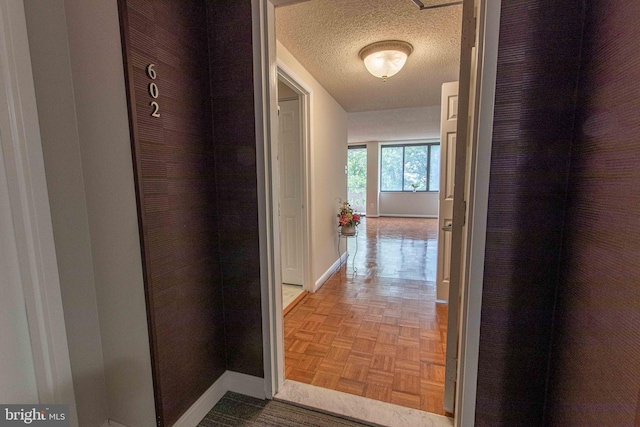 6301 Stevenson Ave Unit 602, Alexandria, VA 22304 - hallway featuring baseboards and a textured ceiling