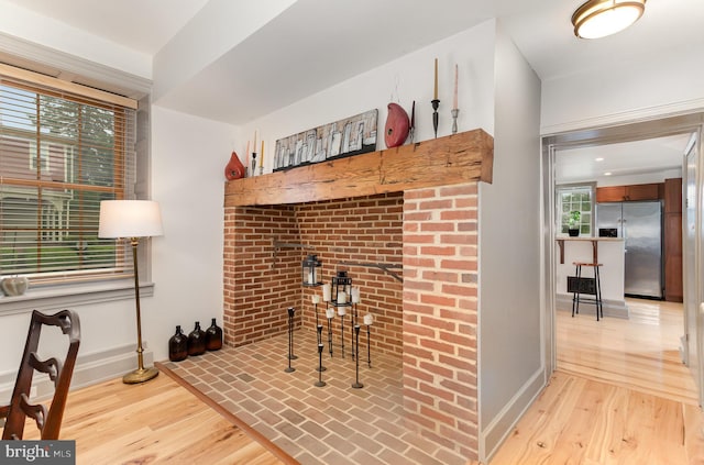 living room featuring light wood-style floors and baseboards