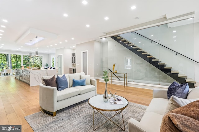 5706 Nevada Ave NW, Washington, DC 20015 - living room featuring light wood-type flooring, stairs, recessed lighting, baseboards, and ornamental molding