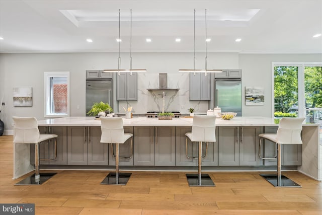 5706 Nevada Ave NW, Washington, DC 20015 - kitchen with built in refrigerator, gray cabinets, a raised ceiling, and recessed lighting