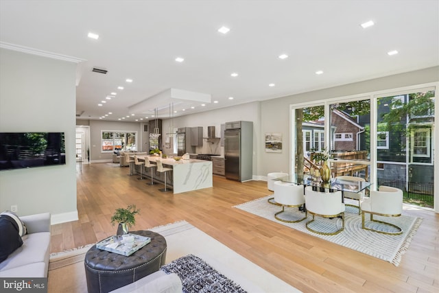 5706 Nevada Ave NW, Washington, DC 20015 - living room with light wood-style floors, baseboards, and recessed lighting