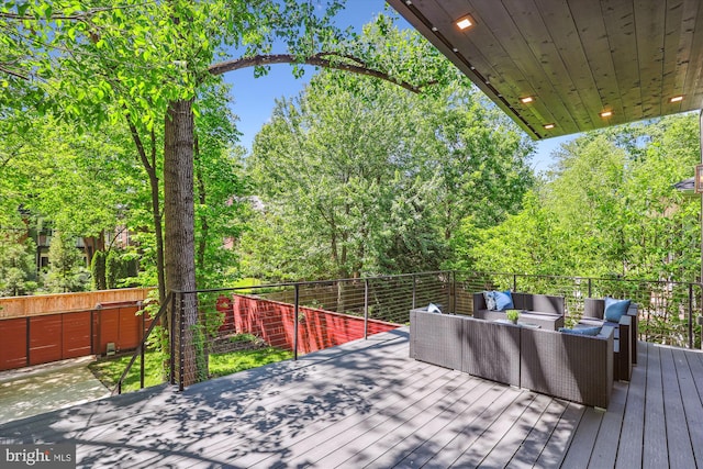 5706 Nevada Ave NW, Washington, DC 20015 - wooden deck with an outdoor living space and a fenced backyard