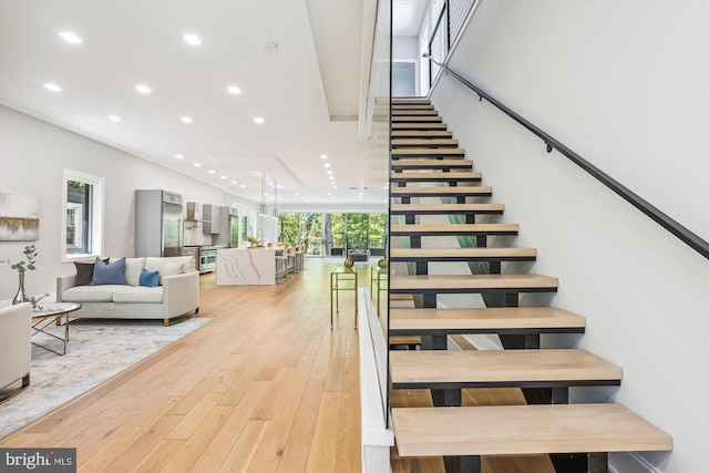 5706 Nevada Ave NW, Washington, DC 20015 - stairway featuring recessed lighting and wood-type flooring