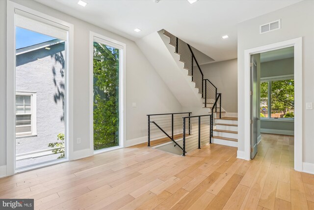5706 Nevada Ave NW, Washington, DC 20015 - foyer with light wood finished floors, baseboards, plenty of natural light, and recessed lighting