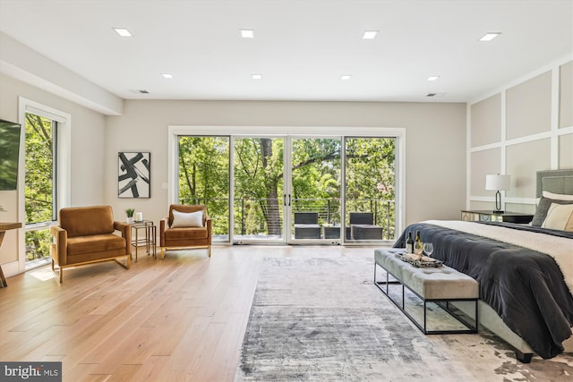 5706 Nevada Ave NW, Washington, DC 20015 - bedroom featuring multiple windows, light wood finished floors, and access to outside