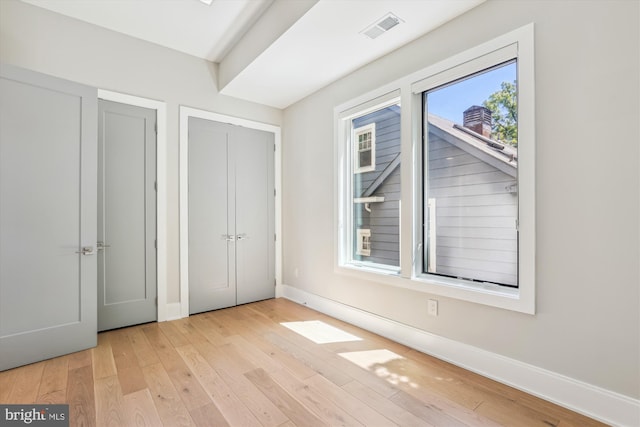 5706 Nevada Ave NW, Washington, DC 20015 - unfurnished bedroom with baseboards and wood-type flooring