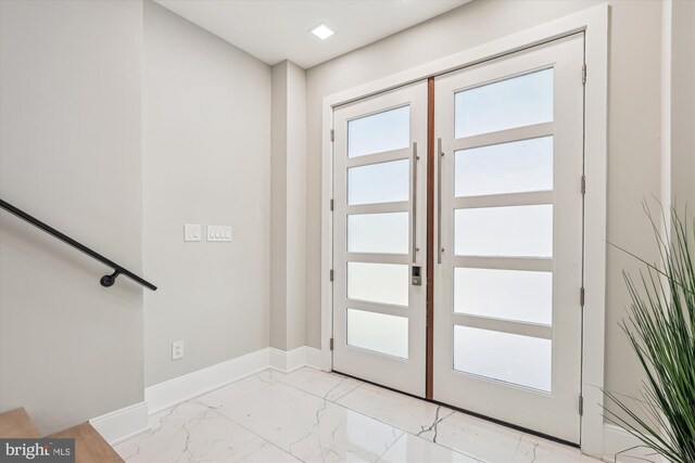 5706 Nevada Ave NW, Washington, DC 20015 - doorway to outside with light marble finish flooring, french doors, and baseboards