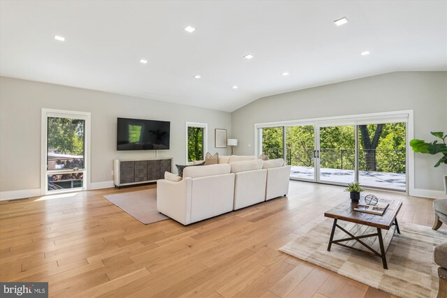 5706 Nevada Ave NW, Washington, DC 20015 - living area featuring lofted ceiling, light wood-type flooring, baseboards, and recessed lighting