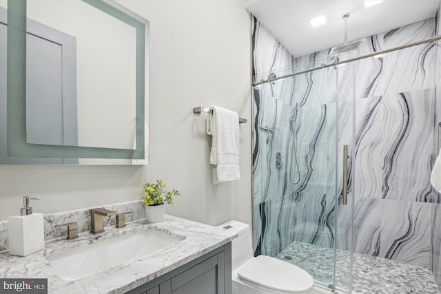 5706 Nevada Ave NW, Washington, DC 20015 - bathroom featuring a marble finish shower, vanity, and toilet