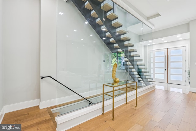 5706 Nevada Ave NW, Washington, DC 20015 - staircase featuring baseboards, wood finished floors, and recessed lighting
