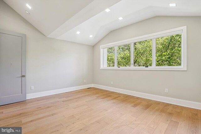 5706 Nevada Ave NW, Washington, DC 20015 - empty room featuring lofted ceiling, light wood finished floors, and baseboards