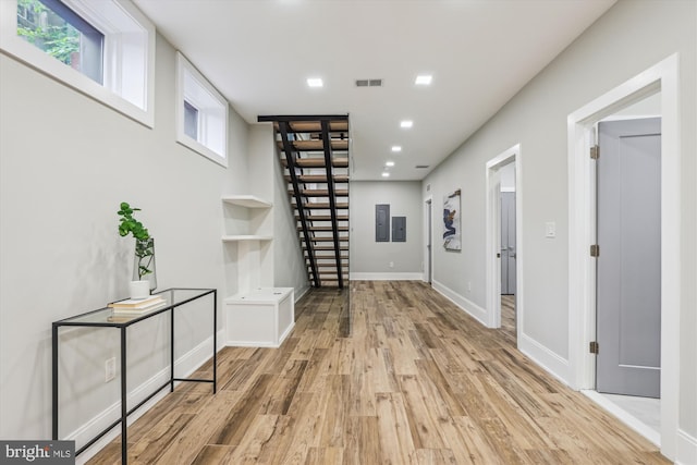 5706 Nevada Ave NW, Washington, DC 20015 - corridor with wood finished floors, baseboards, stairs, recessed lighting, and electric panel