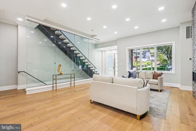 5706 Nevada Ave NW, Washington, DC 20015 - living area with stairway, light wood-style floors, baseboards, crown molding, and recessed lighting
