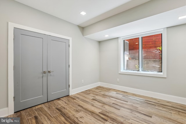 5706 Nevada Ave NW, Washington, DC 20015 - unfurnished bedroom with wood finished floors, baseboards, a closet, and recessed lighting
