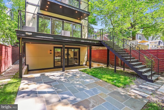 5706 Nevada Ave NW, Washington, DC 20015 - back of property featuring stairs, fence, a patio, and french doors