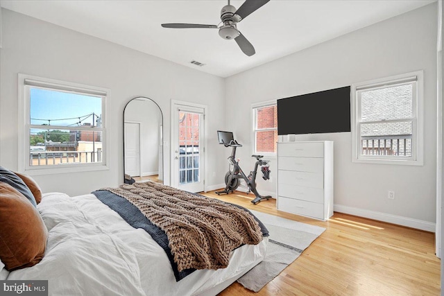 1407 15th St NW Unit 4, Washington, DC 20005 - bedroom with light wood-type flooring, baseboards, and a ceiling fan
