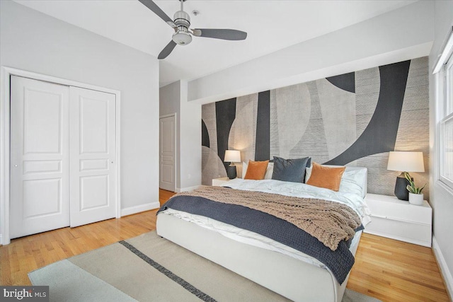 1407 15th St NW Unit 4, Washington, DC 20005 - bedroom featuring wood finished floors, baseboards, a closet, and a ceiling fan