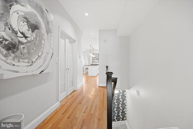 1407 15th St NW Unit 4, Washington, DC 20005 - hall featuring an upstairs landing, light wood-style flooring, recessed lighting, and baseboards