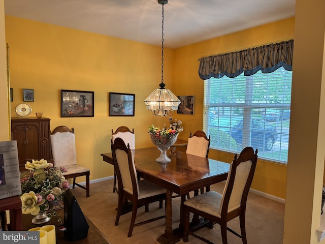 14 Pelican Ln, Tuckerton, NJ 08087 - carpeted dining room featuring baseboards and a chandelier