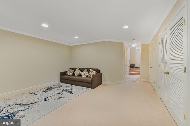 living area with recessed lighting, baseboards, light colored carpet, and crown molding