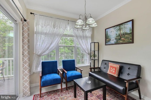 living area with a chandelier, baseboards, healthy amount of natural light, and crown molding
