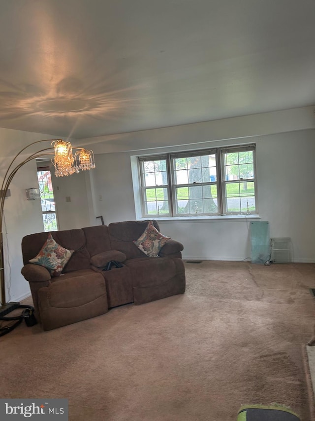 59 Emerald Ln, Willingboro, NJ 08046 - living room featuring a chandelier and carpet flooring