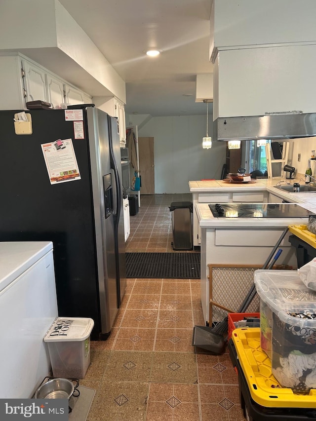 59 Emerald Ln, Willingboro, NJ 08046 - kitchen with black electric stovetop, white cabinets, light countertops, and stainless steel fridge with ice dispenser
