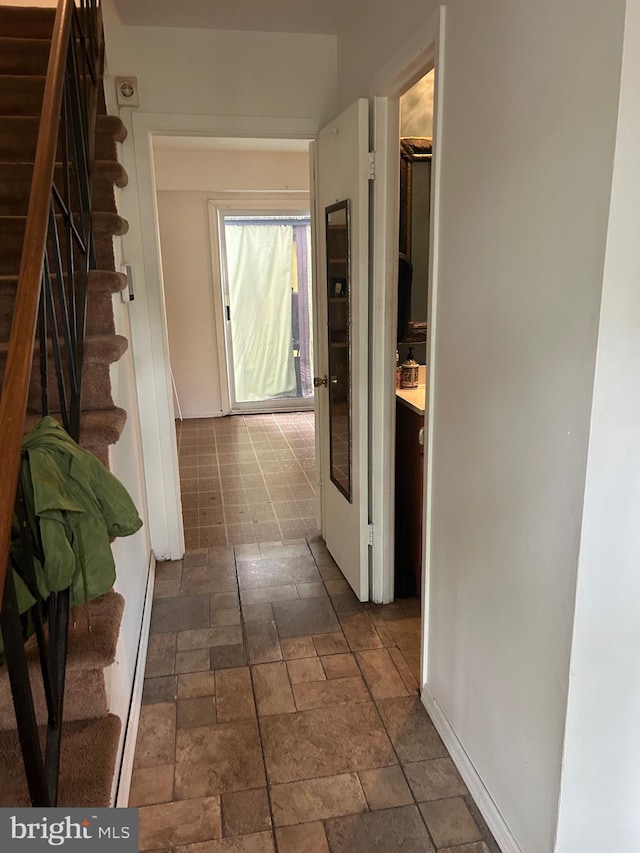 59 Emerald Ln, Willingboro, NJ 08046 - hall with stairway, stone tile flooring, and baseboards