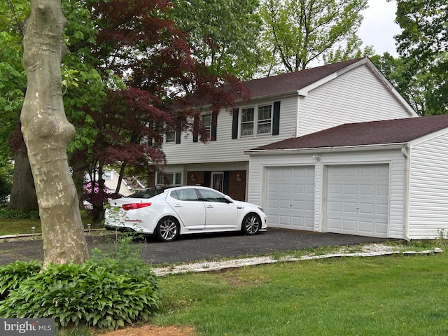 59 Emerald Ln, Willingboro, NJ 08046 - view of front of property with a garage, asphalt driveway, and a front yard
