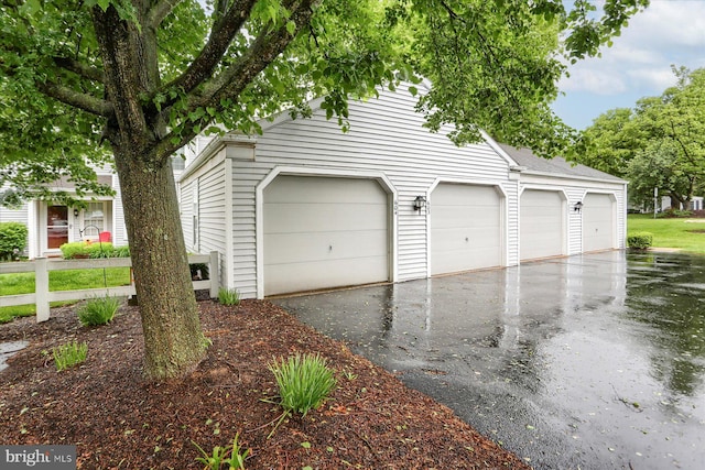 garage featuring driveway