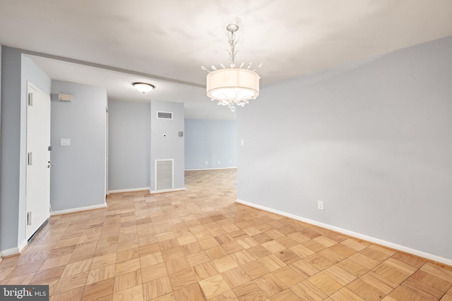 4620 N Park Ave N Unit 1206E, Chevy Chase, MD 20815 - empty room with baseboards and a chandelier