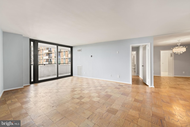 4620 N Park Ave N Unit 1206E, Chevy Chase, MD 20815 - unfurnished room with baseboards and a chandelier
