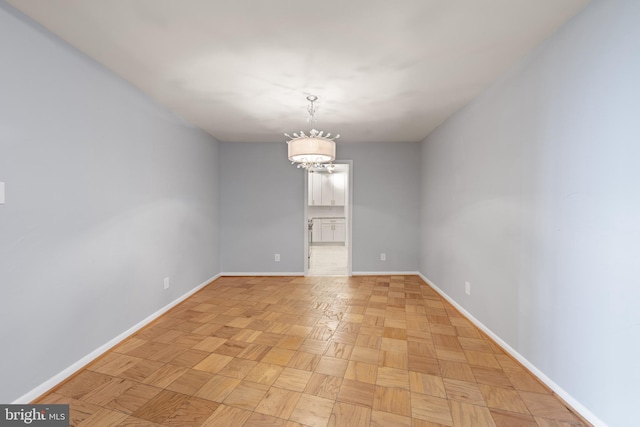 4620 N Park Ave N Unit 1206E, Chevy Chase, MD 20815 - spare room with baseboards and a chandelier