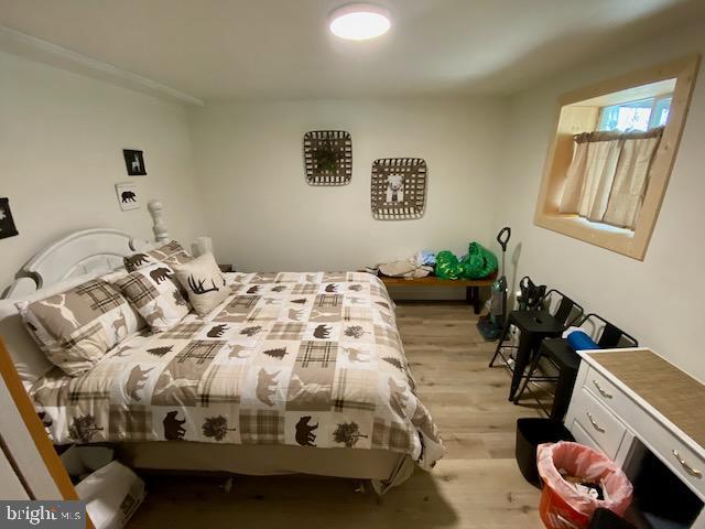bedroom with light wood-style flooring