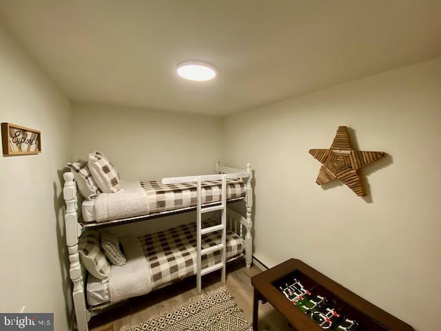 bedroom featuring wood finished floors