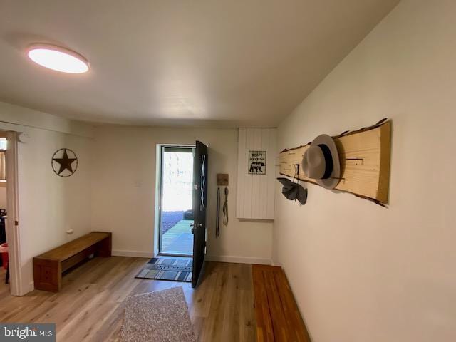 entryway featuring light wood finished floors and baseboards