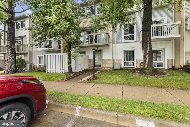 7233 Jillspring Ct Unit 18C, Springfield, VA 22152 - view of property with brick siding and a front yard