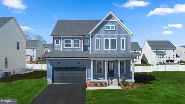 112 Heyford Dr, Stephenson, VA 22656 - view of front facade with covered porch, board and batten siding, driveway, a residential view, and an attached garage