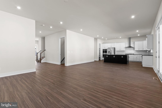 114 Heyford Dr, Stephenson, VA 22656 - unfurnished living room with a sink, recessed lighting, baseboards, and dark wood-style flooring