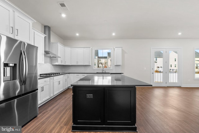 114 Heyford Dr, Stephenson, VA 22656 - kitchen with stainless steel appliances, dark wood-style floors, wall chimney range hood, a center island, and backsplash