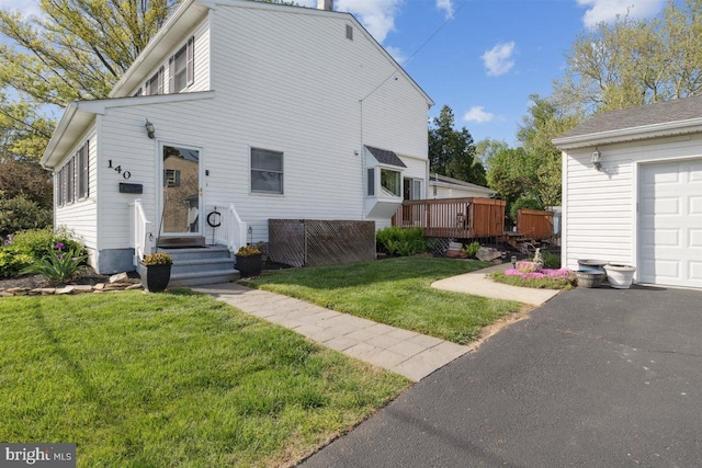 140 Grandview Ave, Hamilton, NJ 08620 - view of front facade with driveway, a front yard, a wooden deck, and a garage