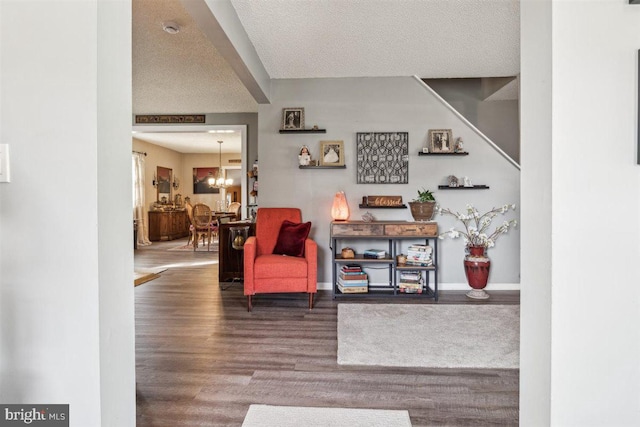 140 Grandview Ave, Hamilton, NJ 08620 - sitting room with wood finished floors, a chandelier, baseboards, and a textured ceiling