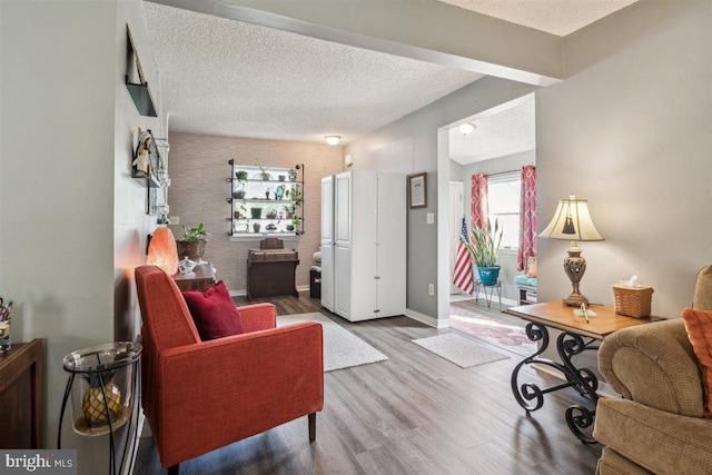 140 Grandview Ave, Hamilton, NJ 08620 - living room featuring a textured ceiling, wood finished floors, and baseboards
