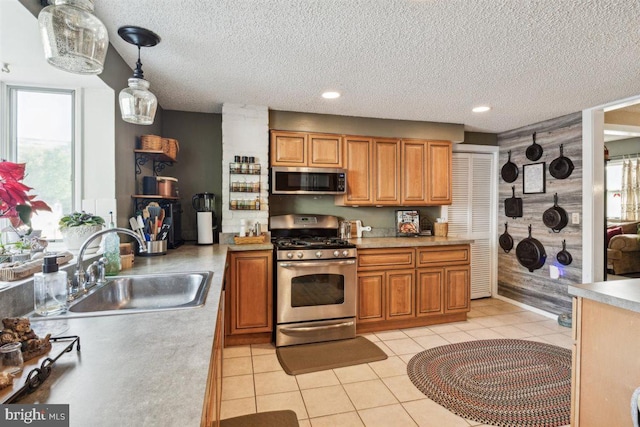 140 Grandview Ave, Hamilton, NJ 08620 - kitchen with stainless steel appliances, a sink, a textured ceiling, light countertops, and light tile patterned floors