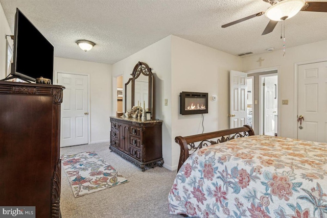 140 Grandview Ave, Hamilton, NJ 08620 - carpeted bedroom with a textured ceiling, baseboards, ceiling fan, and a glass covered fireplace