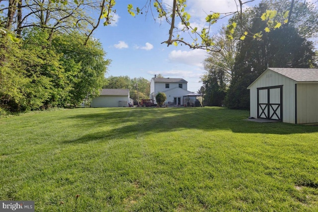 140 Grandview Ave, Hamilton, NJ 08620 - view of green lawn featuring a storage unit and an outdoor structure